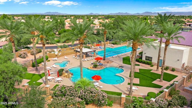 view of pool with a patio and a mountain view