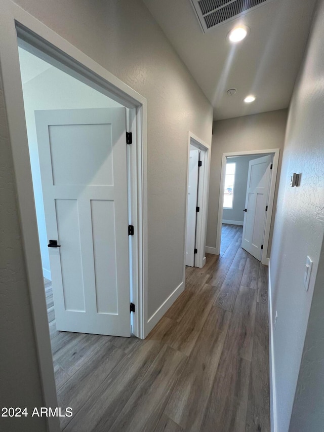 hallway featuring wood-type flooring