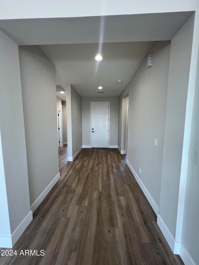 corridor with dark wood-type flooring