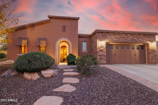 view of front of property with a garage