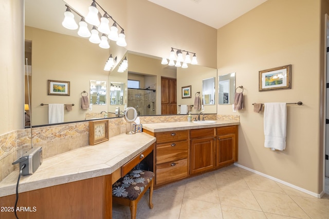 bathroom with vanity, an enclosed shower, and tile patterned floors