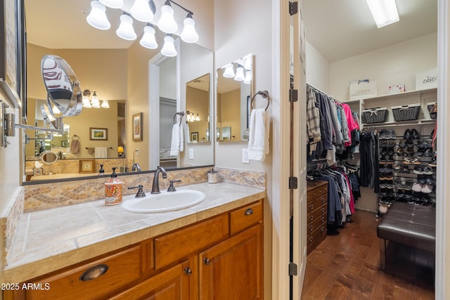 bathroom with hardwood / wood-style flooring and vanity