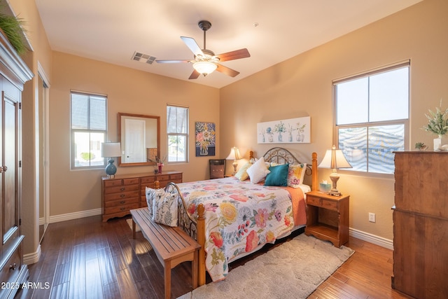 bedroom with hardwood / wood-style floors and ceiling fan