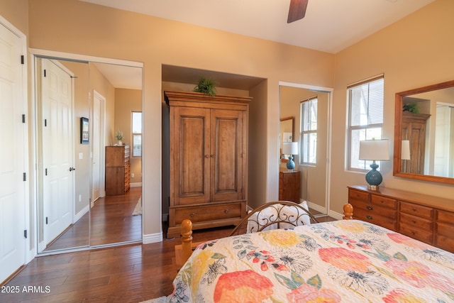 bedroom with ceiling fan and dark hardwood / wood-style flooring