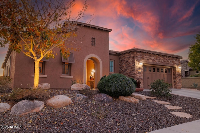 view of front of property featuring a garage