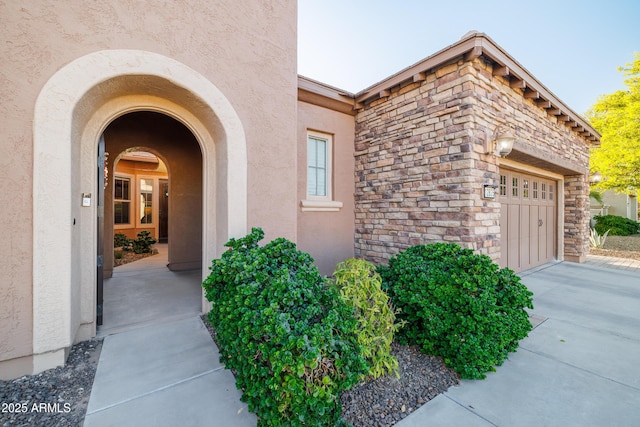 property entrance with a garage