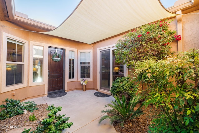 doorway to property featuring a patio area