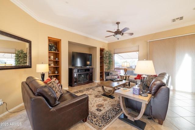 living room with crown molding, light tile patterned floors, and built in features