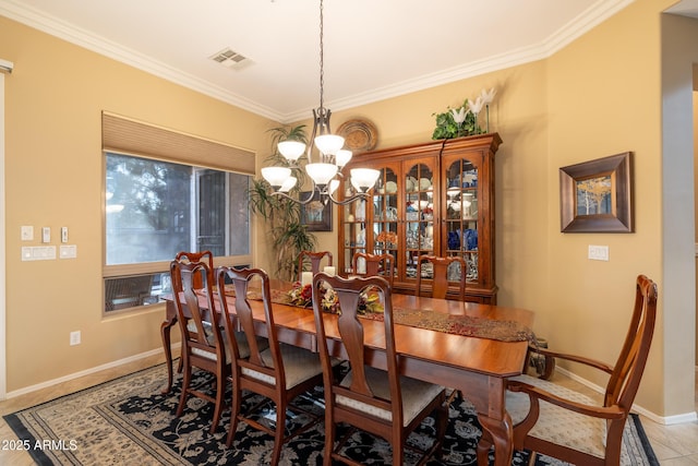 dining area featuring an inviting chandelier and ornamental molding