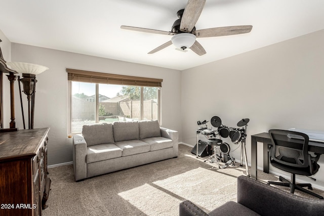 living room featuring carpet flooring and ceiling fan