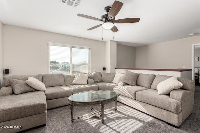 living room with ceiling fan and carpet floors