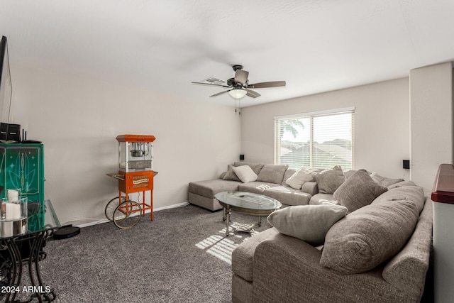 carpeted living room with ceiling fan