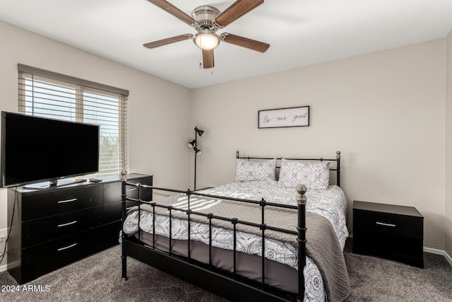 bedroom featuring ceiling fan and carpet