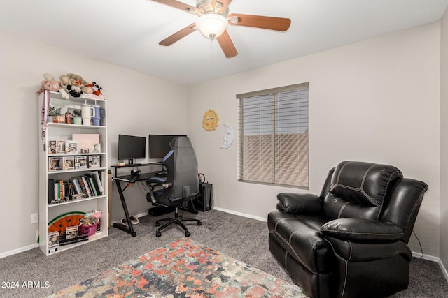 carpeted office space featuring ceiling fan