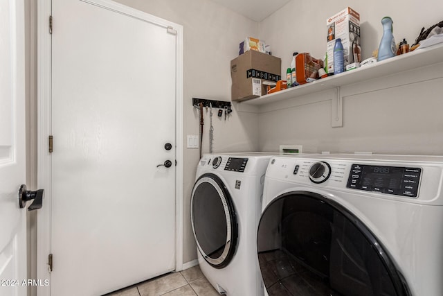 laundry area featuring independent washer and dryer and light tile patterned floors