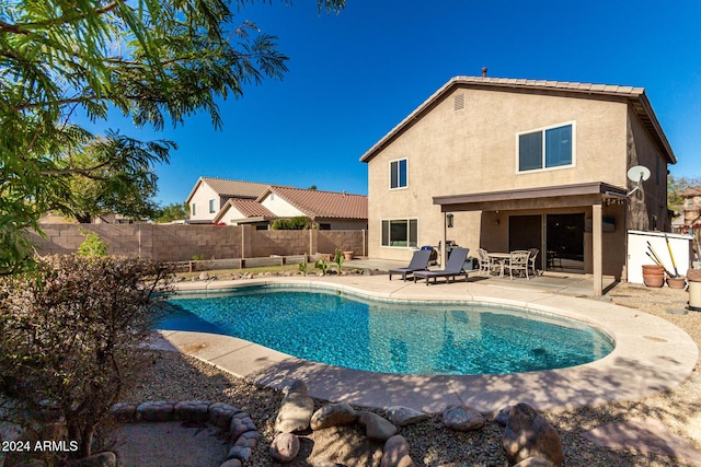 view of pool featuring a patio area