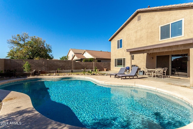 view of swimming pool featuring a patio