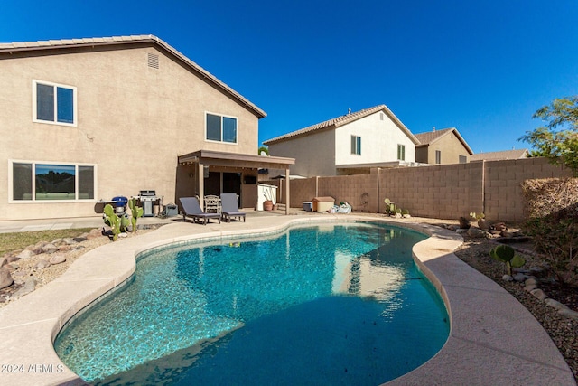 view of swimming pool featuring a patio