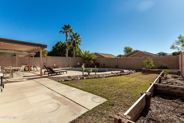 view of yard with a patio area and a fenced in pool