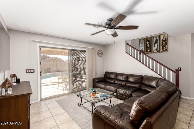 tiled living room with ceiling fan