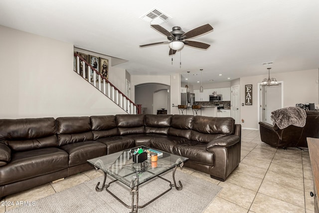 living room with ceiling fan and light tile patterned floors