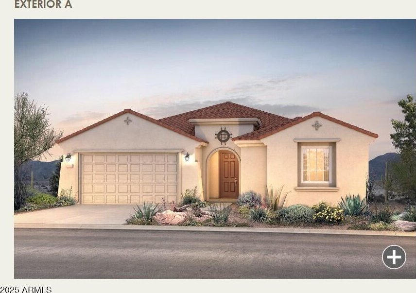 mediterranean / spanish-style home with a tile roof, stucco siding, concrete driveway, and a garage