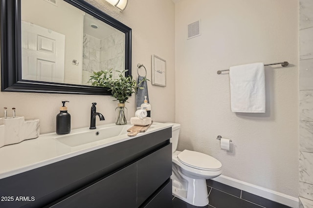 bathroom featuring tile patterned flooring, visible vents, toilet, and vanity