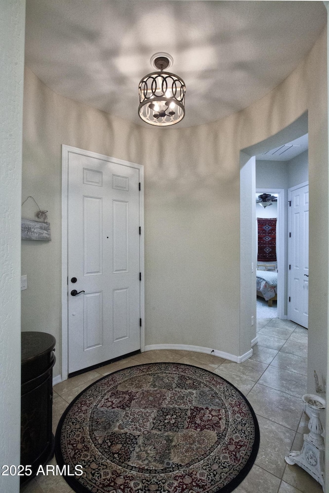 entryway with light tile patterned floors