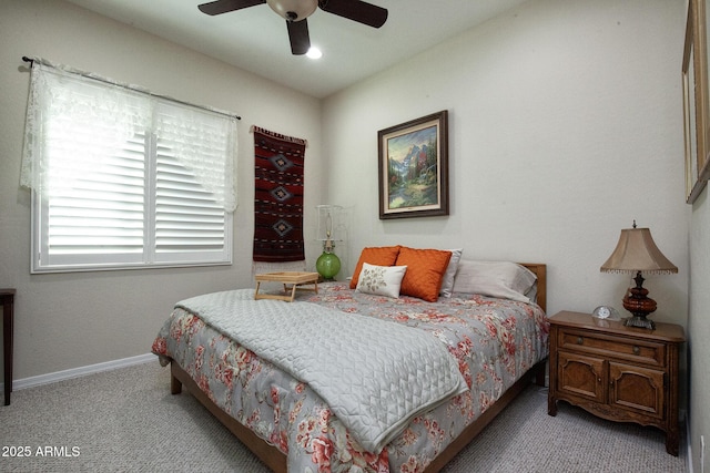 bedroom with light carpet and ceiling fan