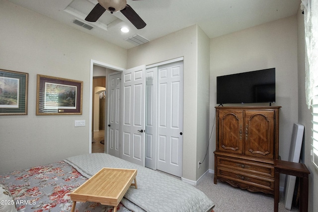 bedroom featuring ceiling fan, a closet, and carpet floors