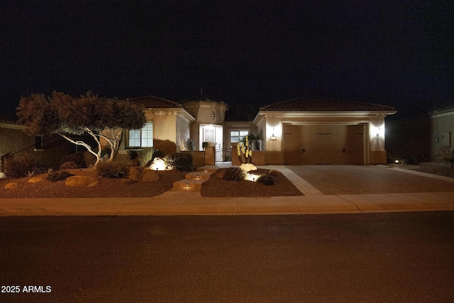 view of front of home with a garage