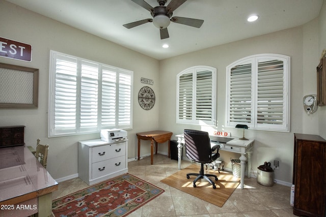 tiled home office featuring ceiling fan