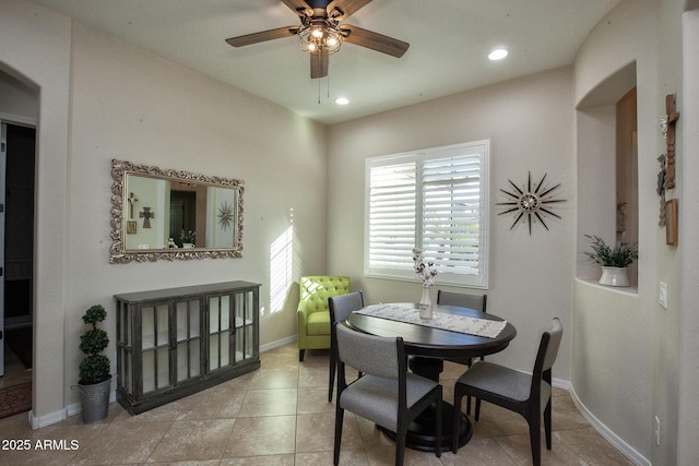 tiled dining room with ceiling fan