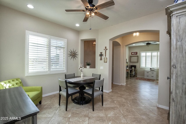 tiled dining room with ceiling fan