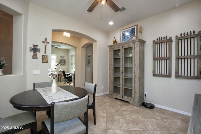 dining area featuring ceiling fan and light tile patterned floors