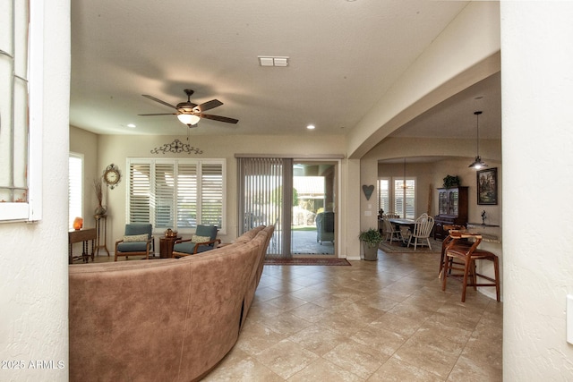 living room with ceiling fan