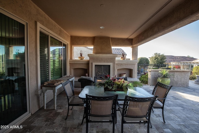 view of patio / terrace featuring an outdoor fireplace