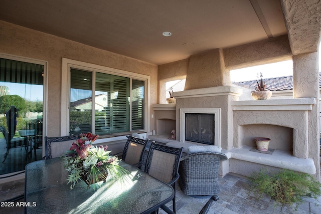 view of patio / terrace with an outdoor fireplace