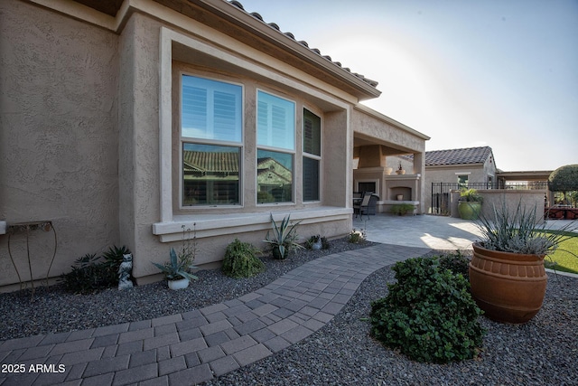 view of patio featuring an outdoor fireplace