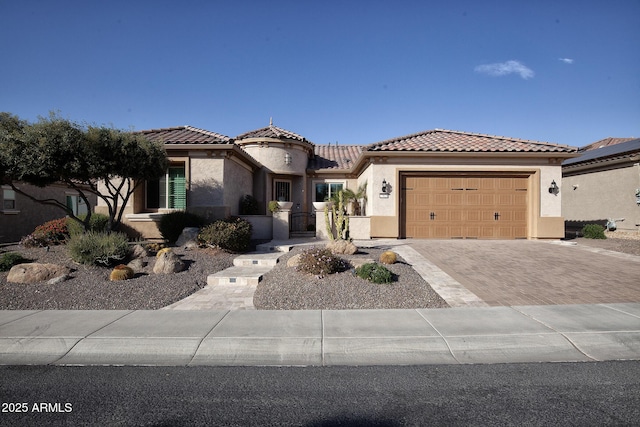 mediterranean / spanish-style house featuring a garage