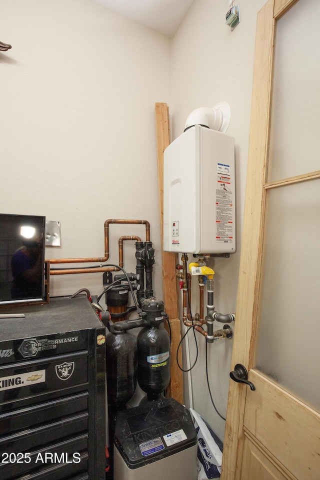 utility room featuring water heater