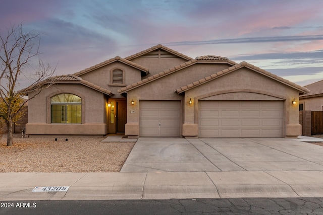 view of front of home with a garage