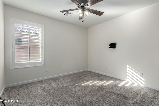 unfurnished room with carpet floors and ceiling fan