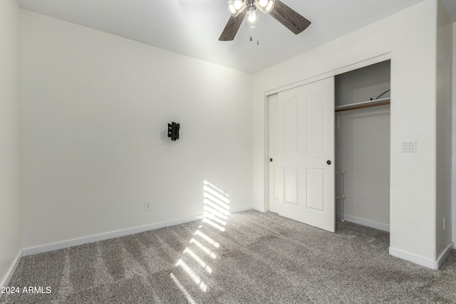 unfurnished bedroom featuring a closet, carpet floors, and ceiling fan