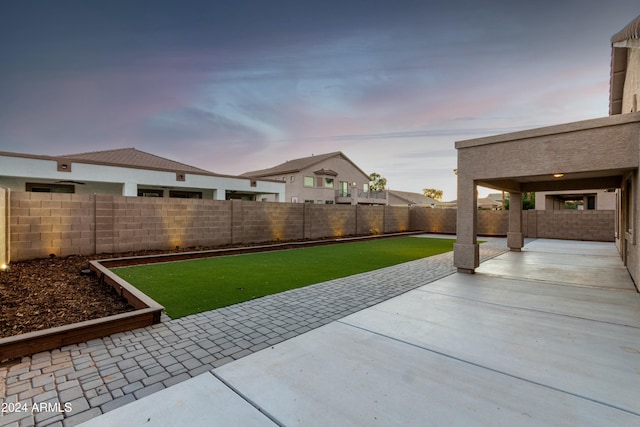 view of patio terrace at dusk