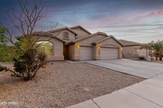 view of front of property with a garage