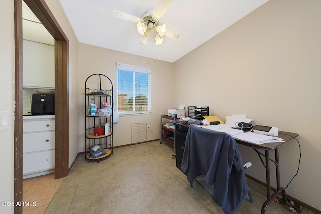 office area with baseboards, visible vents, a ceiling fan, and light tile patterned flooring