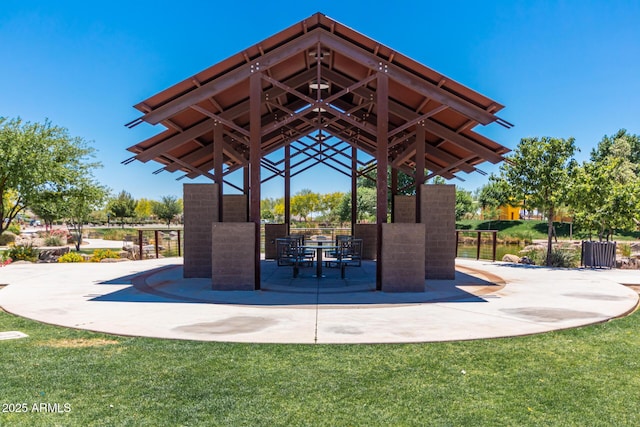 view of property's community with a patio area and a lawn