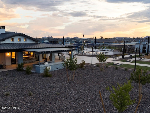 exterior space featuring a patio and a water view