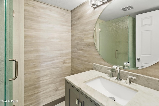 bathroom with vanity and a textured ceiling